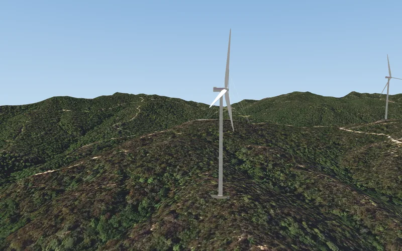 A wind turbine of the Breda wind farm on the wooded ridge, the next one behind it, the sky above